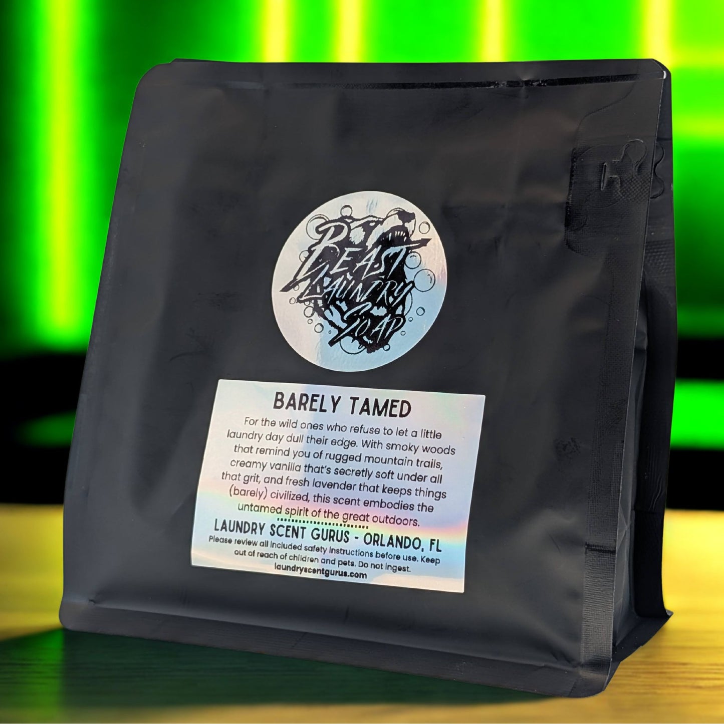 Black laundry detergent bag with a label on a colorful background