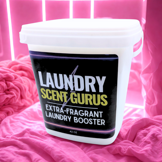 Laundry Scent Gurus extra-fragrant laundry booster container on pink fabric background