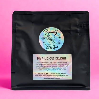 Black bag with 'Beauty Booster' label on a pink background