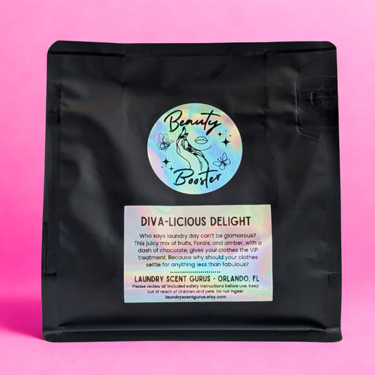 Black bag with 'Beauty Booster' label on a pink background