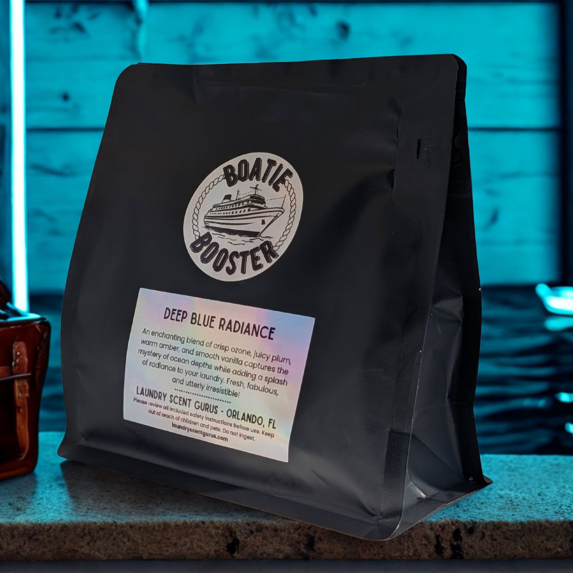Black bag with 'Boatie Booster' label on a blurred background