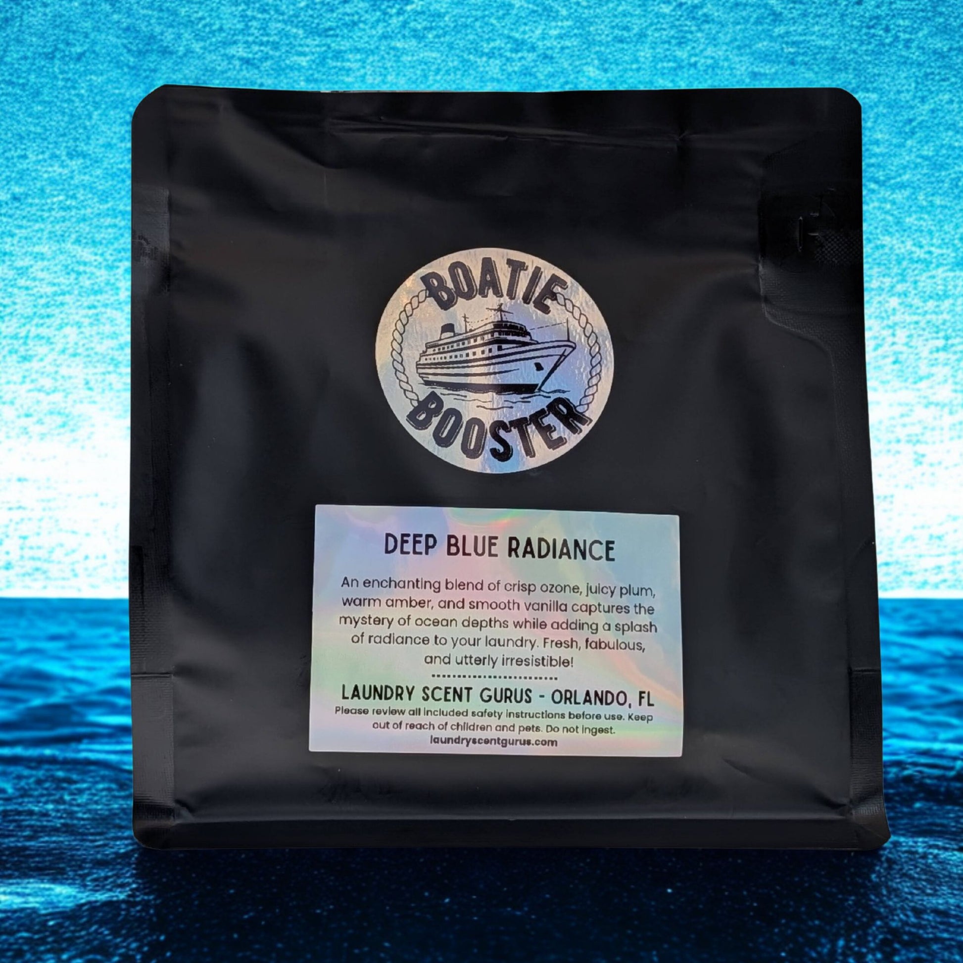 Black bag with 'Boatie Booster' label on a blue water background
