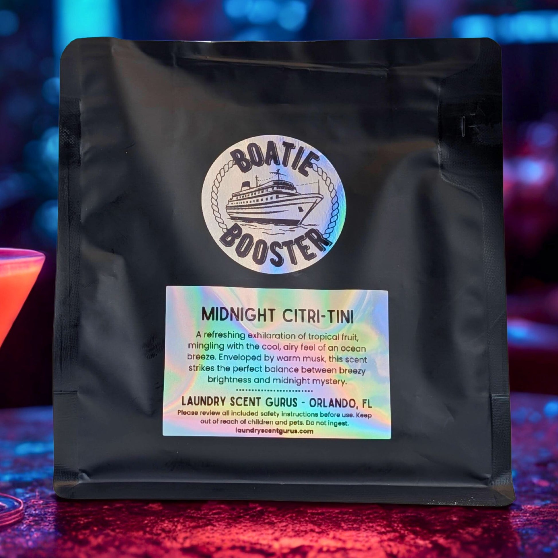 Black bag with a label featuring 'Boatie Booster' on a colorful background