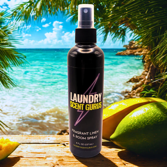 Laundry Scent Gurus spray bottle with a tropical background featuring palm trees and a beach.